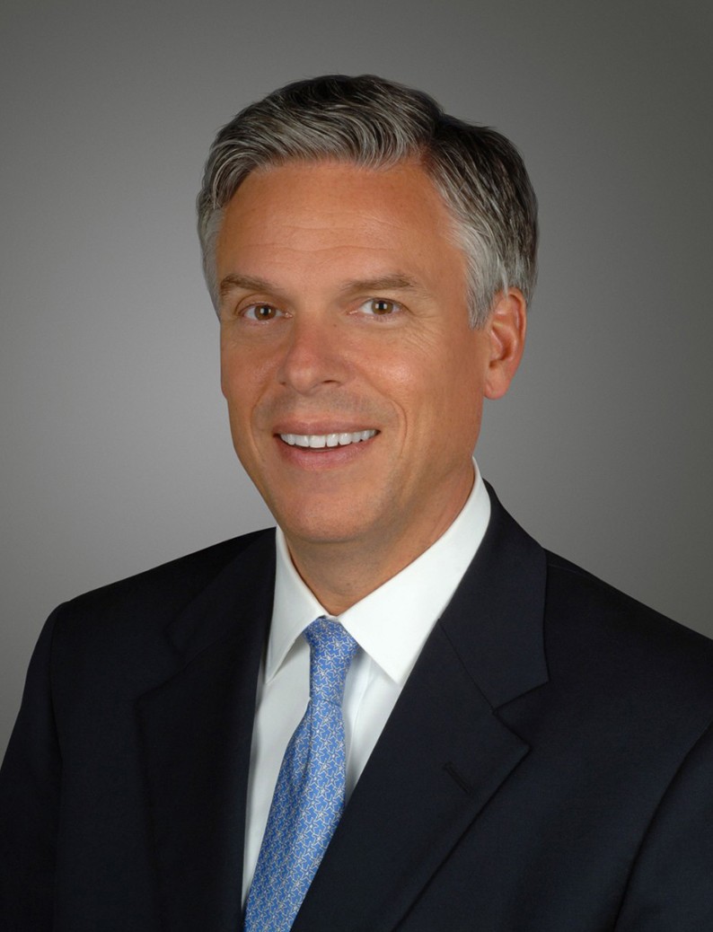 Male employee smiles for camera