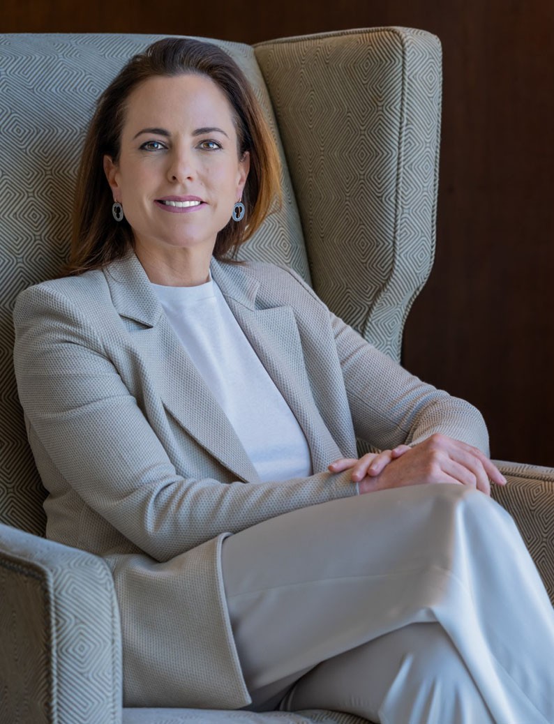 Female employee smiles for camera