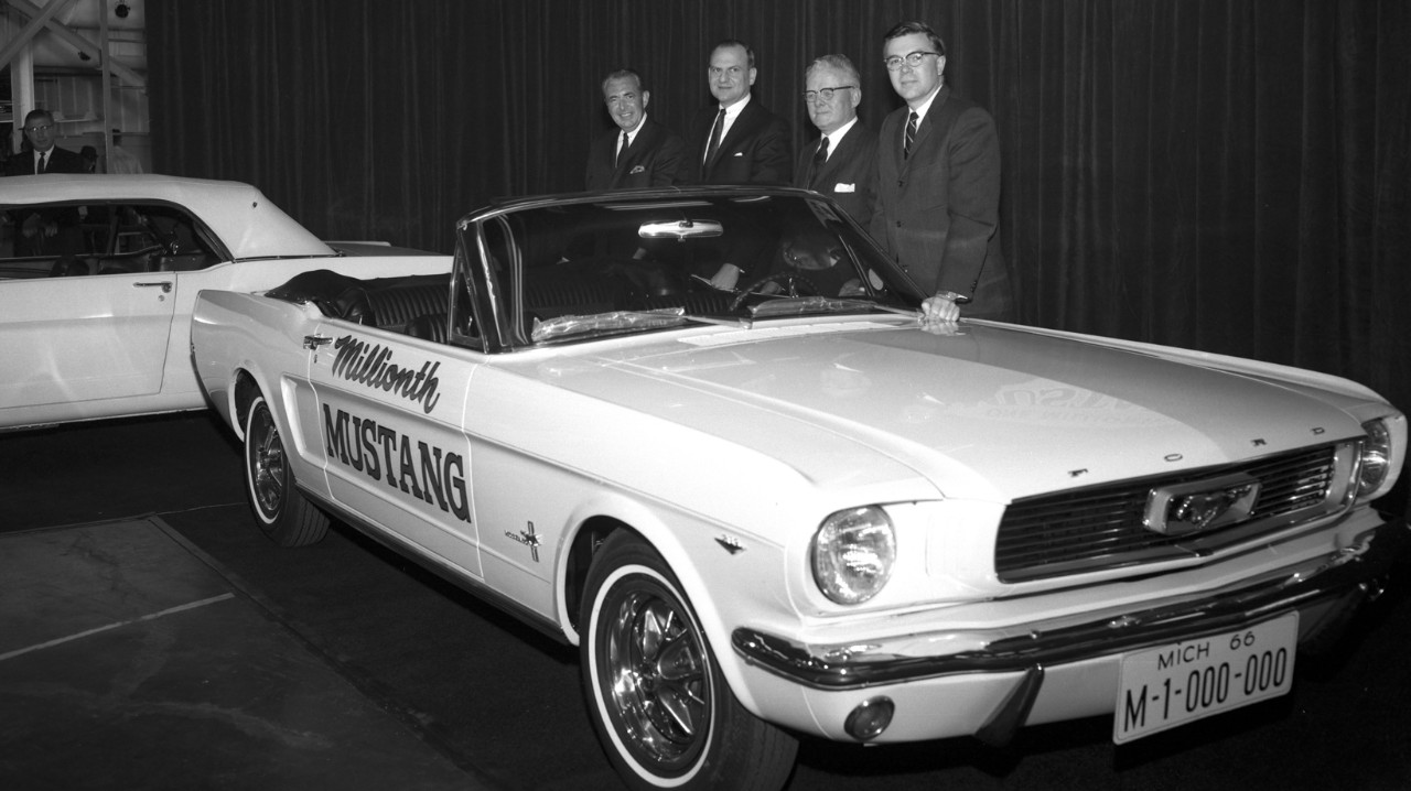 One Millionth Mustang, 1966 Three men posing in front of a Mustang car