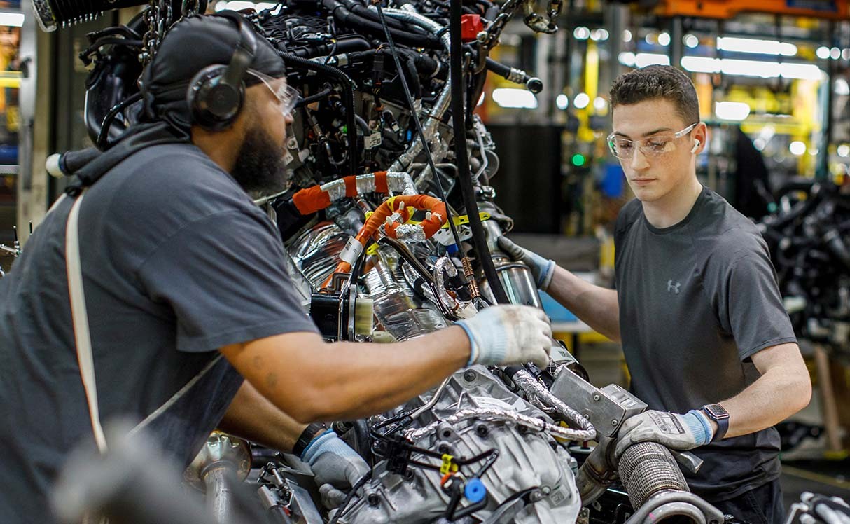 Two men working on an assembly line